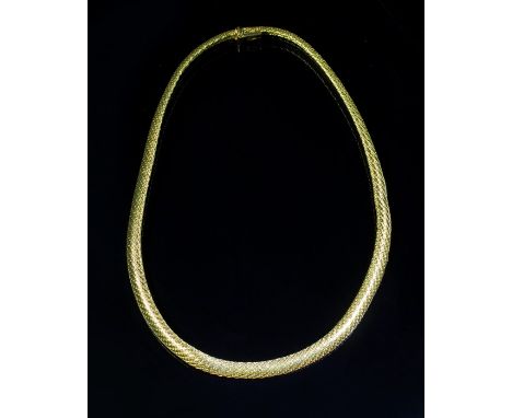 A yellow metal collar, the fancy flattened chevron pattern necklace to a push button clasp, marked 18K, 43cm length 41.5g