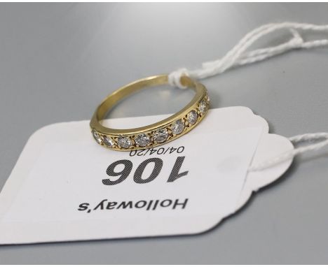 A half hoop diamond eternity ring, the nine brilliant cut diamonds channel set in plain mount Ring Size N, 2.3g