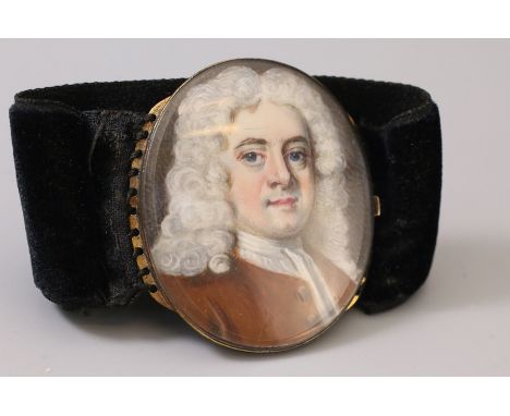 An early 18th century portrait miniature of a gentleman, named as Vigerus Edwards, the oval bust portrait depicting the sitte