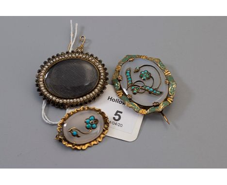A Victorian enamel turquoise and agate oval brooch, with applied floral motif to oval agate within a scroll engraved enamel b
