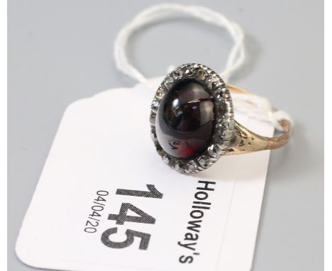 ***AUCTIONEER TO ANNOUNCE X7 STONES ARE WHITE SAPPHIRE/TOPAZ ALONG WITH DIAMOND SET BORDER****A mid 19th century garnet and d