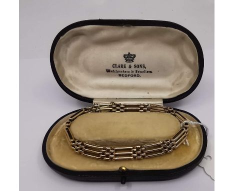 A 15ct gold gate link bracelet of rounded hollow links, stamped 15ct to concealed push button clasp, weight approx. 15gms, fi