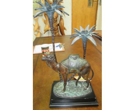CANDLESTICK HOLDER, in the form of a camel and palm trees, 44cm H x 21cm W x 13cm D.