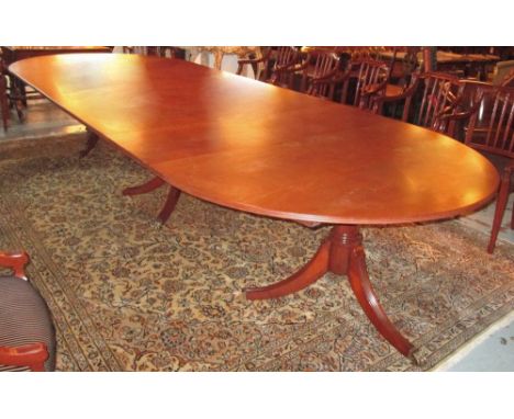 TRIPLE PEDESTAL DINING TABLE, Georgian style mahogany with elliptical ends and two extra leaves (two support bars lacking) 77