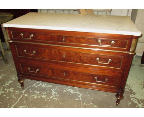 COMMODE, Directoire mahogany and brass mounted, circa 1795, with white marble top above three long drawers, 88cm H x 125cm W 