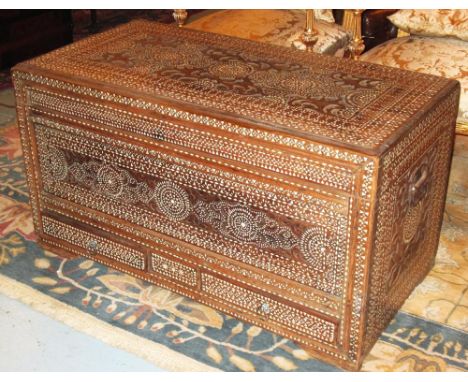COLONIAL TRUNK, 19th century teak and mother of pearl profusely inlaid with rising lid and two drawers, 102cm x 5cm x 58cm H.