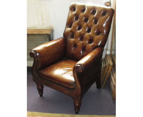 LIBRARY BERGERE, early 19th century William IV mahogany and faded tan leather upholstered with button back and lappet turned 