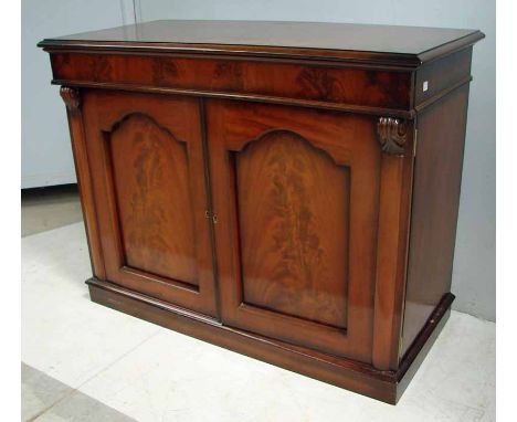 A Victorian mahogany chiffonier base, the rectangular moulded edge top over a linear drawer above a pair of shaped panel door