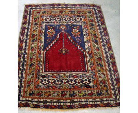 A pair of Bergama wool prayer rugs, circa 1920, handmade, with stepped horseshoe mirhab and hanging lantern within multiple b