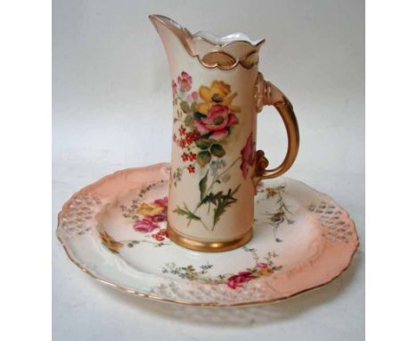 A Royal Worcester jug vase of tusk form, painted flower sprays on a blush ivory and gilt highlighted ground, gilt handle, 15.