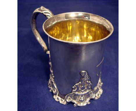 A Victorian silver tankard of circular form with everted rim, leaf capped S scroll handle, cast four section foot, Henry Wilk