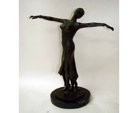 An Art Deco style bronze patinated figural model of a female dancer, standing on tip toes arms outstretched, bears Noee signa