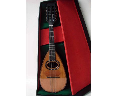 An early 20th century eight string Neapolitan style mandolin, painted and inlaid light wood tear shape body, ebonised neck, b