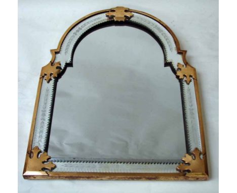 An attractive 19th century wall mirror of rectangular arch top form, the glass plate set within a brass frame with foliate cu