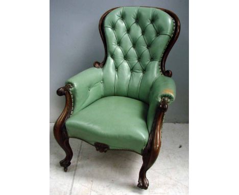 A Victorian walnut show frame gentleman’s parlour chair, moulded back, carved front legs, sabre rear legs, reupholstered in j