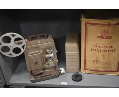 A vintage Bell &amp; Howell auto load 8mm film projector with original box.
