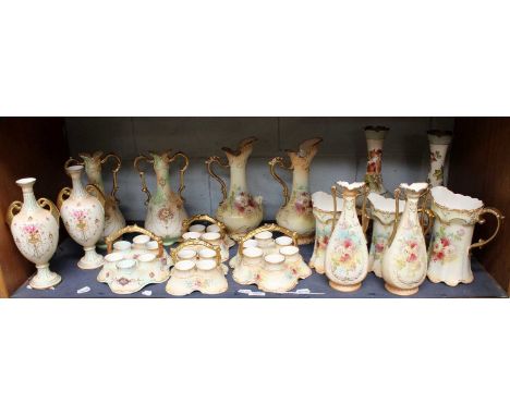 Crown Devon Blush Ivory; three pairs of twin gilt handled vases, a pair of similar jugs, four egg cruets, three further jugs,