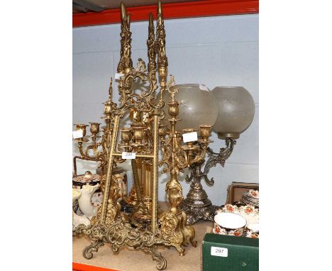 A Pair of Reproduction Brass Four Light Candelabra, a rococo style brass easel, 56cm, two reproduction gilt candlesticks on c