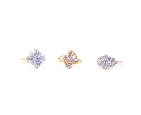 Three tanzanite and diamond rings, to include a lozenge-shaped tanzanite and diamond cluster ring set with nine oval mixed cu