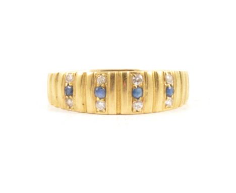 A contemporary sapphire and diamond half hoop ring size S, four sapphires each flanked by a small diamond to top and bottom i