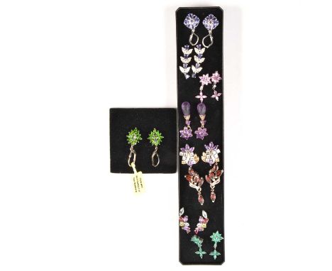 Nine pairs of modern gemset earrings of floral and foliage design, to include Russian diopside, emerald, garnet, and other ge