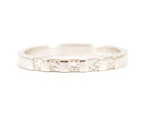 A diamond half eternity ring, five princess cut diamonds set between polished bars in an 18 carat white gold mount, 2.2mm wid