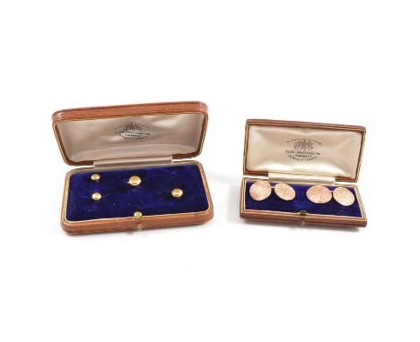 A pair of rose metal cufflinks, the four faces finely scroll engraved, oval connecting link, matching single circular dress s