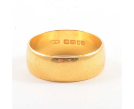 A 22 carat yellow gold wedding band, 6.5mm wide plain polished half D shape ring size M, London 1962, 5.8g.Condition report:P