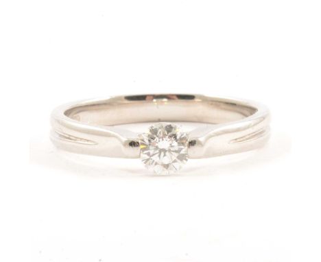 A diamond solitaire ring, the brilliant cut stone tension set in a platinum mount ring size N, 0.40 stamped inside shank indi