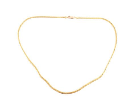 A yellow metal chain necklace, 2mm gauge rolled curb link 53cm long, chain testing as a higher carat gold than the 9 carat lo
