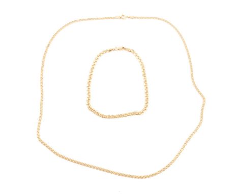 A yellow metal 2.7mm gauge fancy link chain, marked Midas 14K, 49cm; and a yellow metal 3.4mm gauge fancy link bracelet, mark