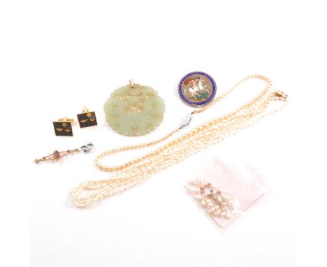 A jade pendant, 55cm carved and pierced disc; triple row freshwater pearl necklace with 14k fastener, 45cm; a simulated pearl