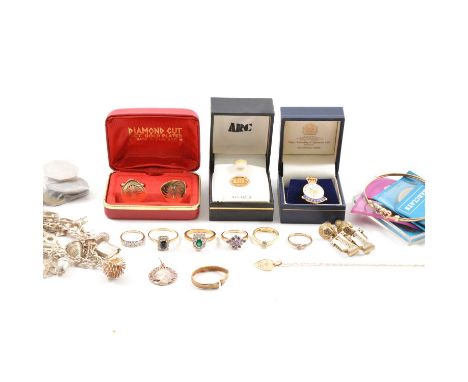 A collection of jewellery, six gemset rings, mostly cubic zirconia; double heart bangle; a silver curb link bracelet with sev
