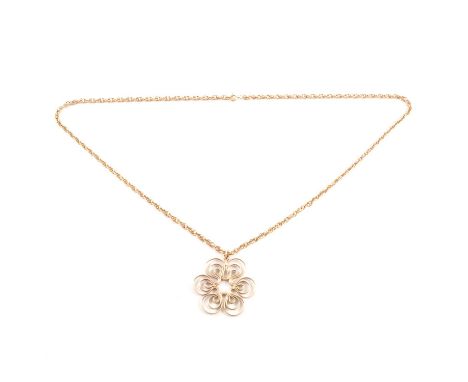 Jack Spencer - a 9 carat yellow gold pendant and chain, a 42mm floral pendant of modernist design, hallmarked Sheffield 1975,