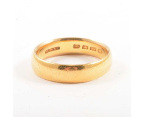 A 22 carat yellow gold wedding band, 5mm wide plain polished half D shape ring size O, London 1922, 6g.