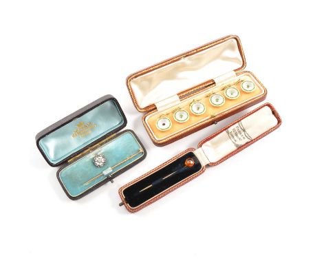 Set of enamel dress studs, the white and green enamel 23mm dish shaped studs, set with green demantoid garnets to centre (one