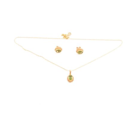 A peridot pendant and matching earrings, the oval mixed cut stones set in 9 carat yellow gold rope edge mounts, fine Prince-o