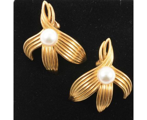 A pair of French gold earrings, an 8mm cultured pearl peg set on a yellow metal triple fluted leaf mount, 30mm, marked AXD, c
