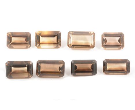 Eight smoky quartz loose stones, all emerald step cut, all ranging from 30x21x14mm to 30x21x15.5mm, total weight 103.3g.Qty: 