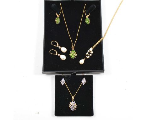 Three necklace and earrings suites, to include tanzanite and diamond, Russian diopside and diamond, and cultured pearl and di