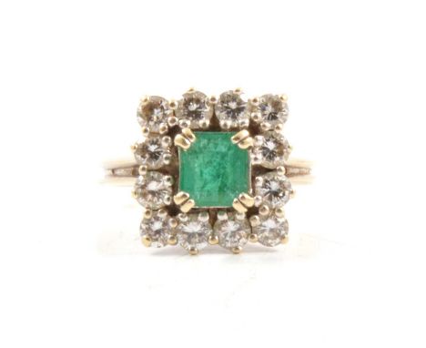 An emerald and diamond square cluster ring, a 5.8mm square cut emerald, set with four double claws and surrounded by twelve b