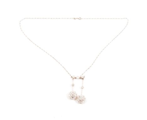 An early 20th century diamond negligee necklace, the two pendant drops comprising a cluster of a central old European cut dia