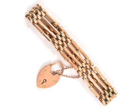 A yellow metal four bar gate link bracelet 15mm wide, padlock fastener marked 9c, 18g.