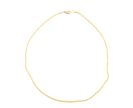 A yellow metal chain necklace, 2mm gauge solid rope link chain 40cm long, chain testing as a higher carat gold than the 9 car