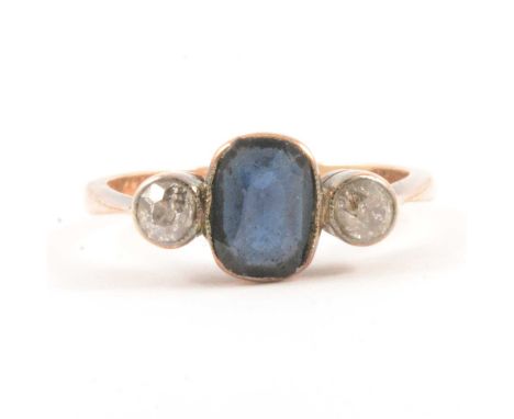 A diamond and blue stone ring, a rectangular blue paste collet set to centre with an old cut diamond to each side in an all y