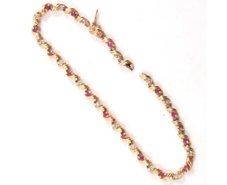 A ruby and diamond bracelet, a 9 carat yellow gold 3.5mm wide bracelet set with sixteen rubies and sixteen small diamonds, 20