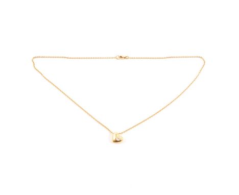 A diamond set heart pendant, the 2.3mm diamond set flush into an 18 carat yellow gold 9.5mm heart on a 38cm trace link chain,