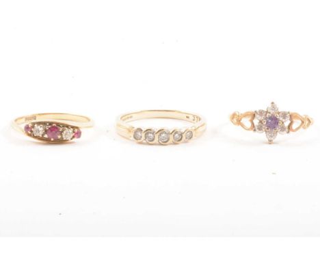 Three gemset rings, a diamond half eternity ring, five diamonds graduating in size set in a 9 carat yellow gold mount ring si