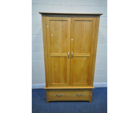 A MODERN LIGHT OAK DOUBLE DOOR WARDROBE, with a single drawer, width 110cm x depth 60cm x height 191cm (condition report: sur