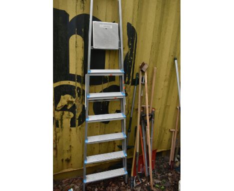 A SELECTION OF GARDEN HAND TOOLS, to include a rake, wilkinson sword fork, etc, along with an aluminium beldray step ladder (